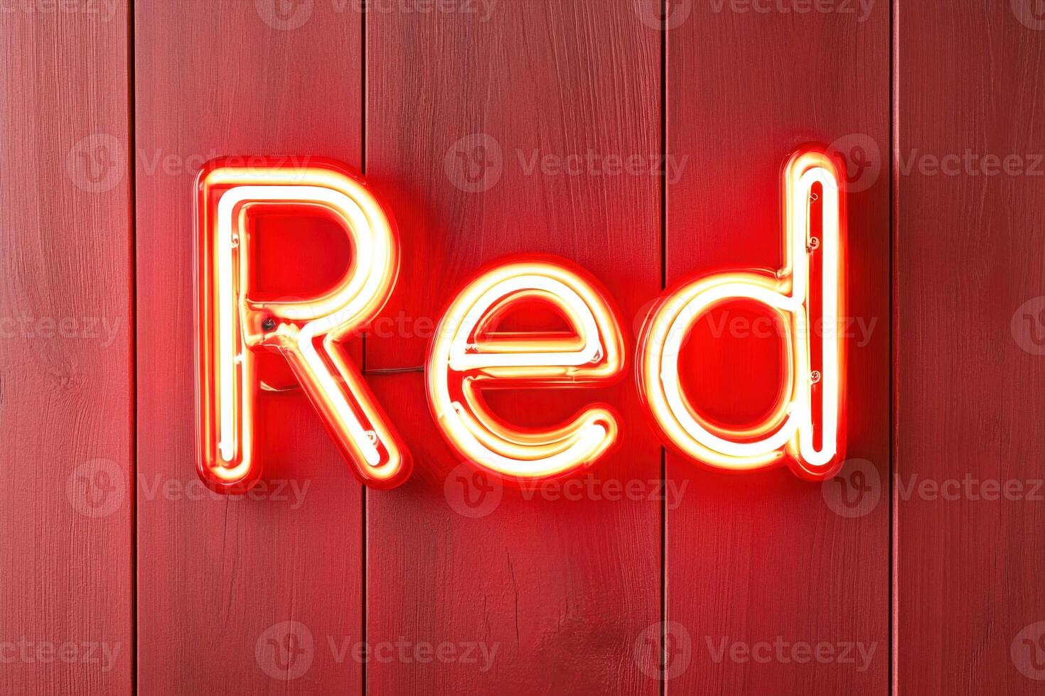 Bright red neon sign glowing vibrantly against a deep red wall creates an eye-catching visual element in an urban setting during the night photo