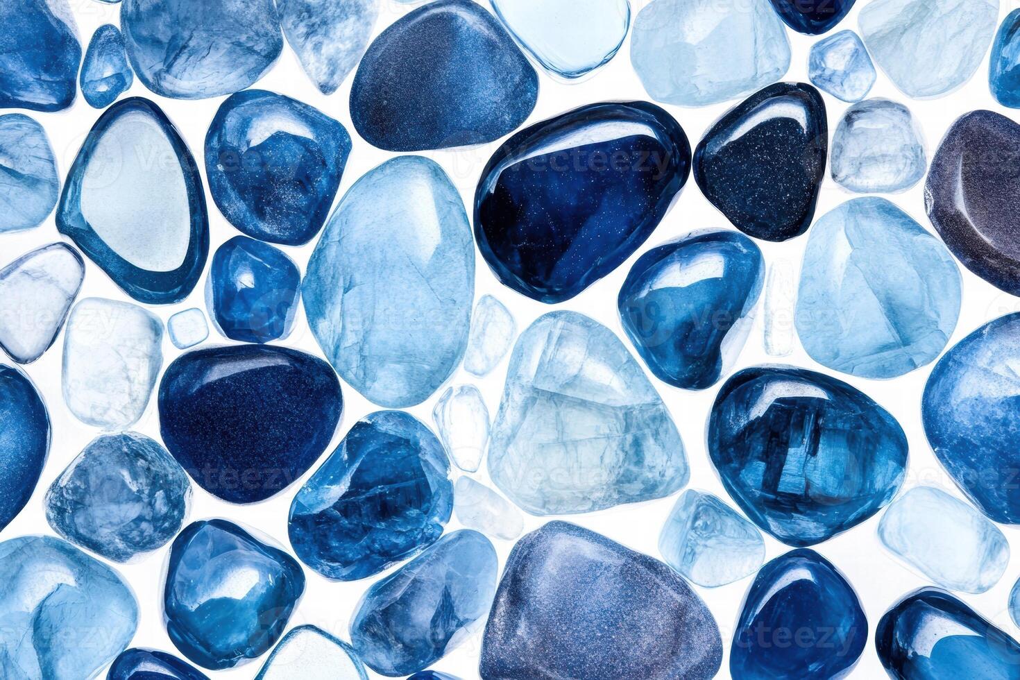 Polished blue gemstones and crystals arranged in a macro shot showcasing shades of blue and intricate textures for visual appeal photo