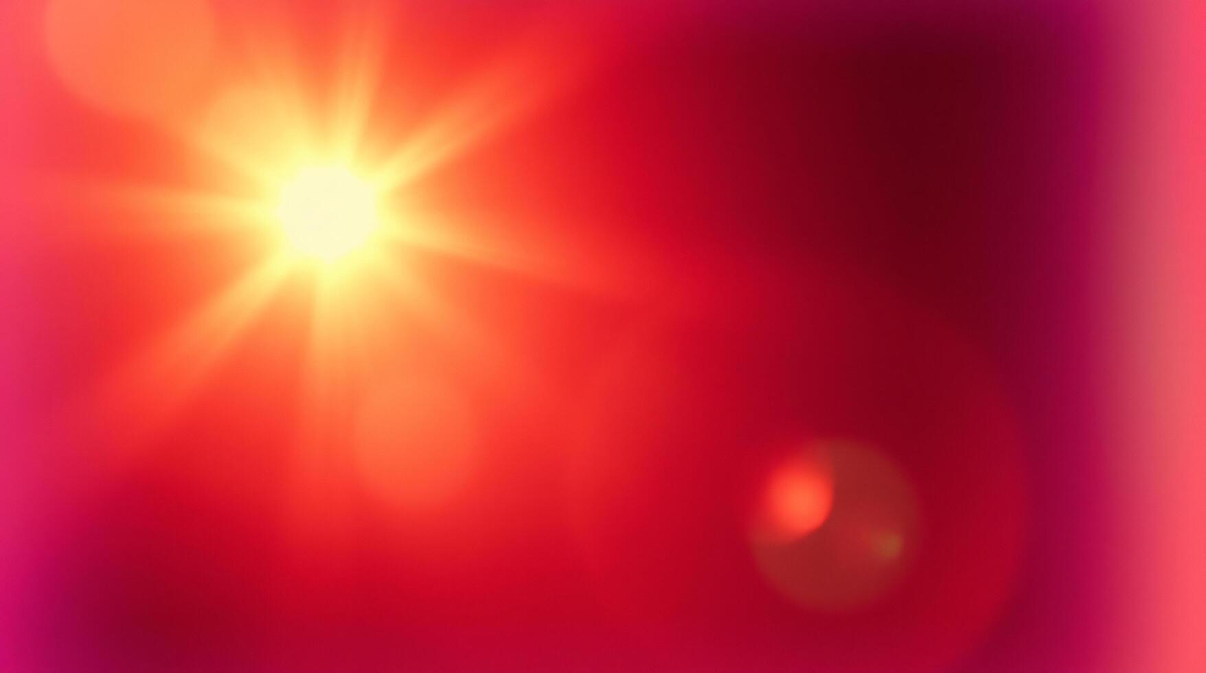 A bright red light is shining in the center of the image photo