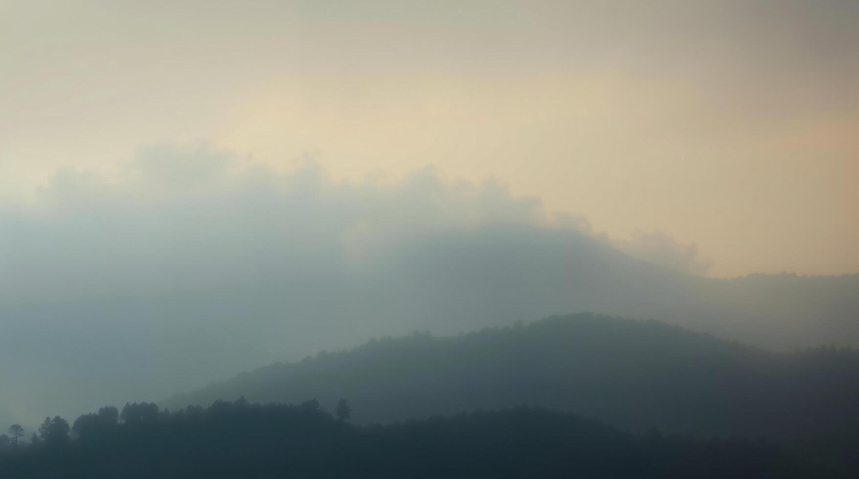 A plane flying over a mountain range with fog photo