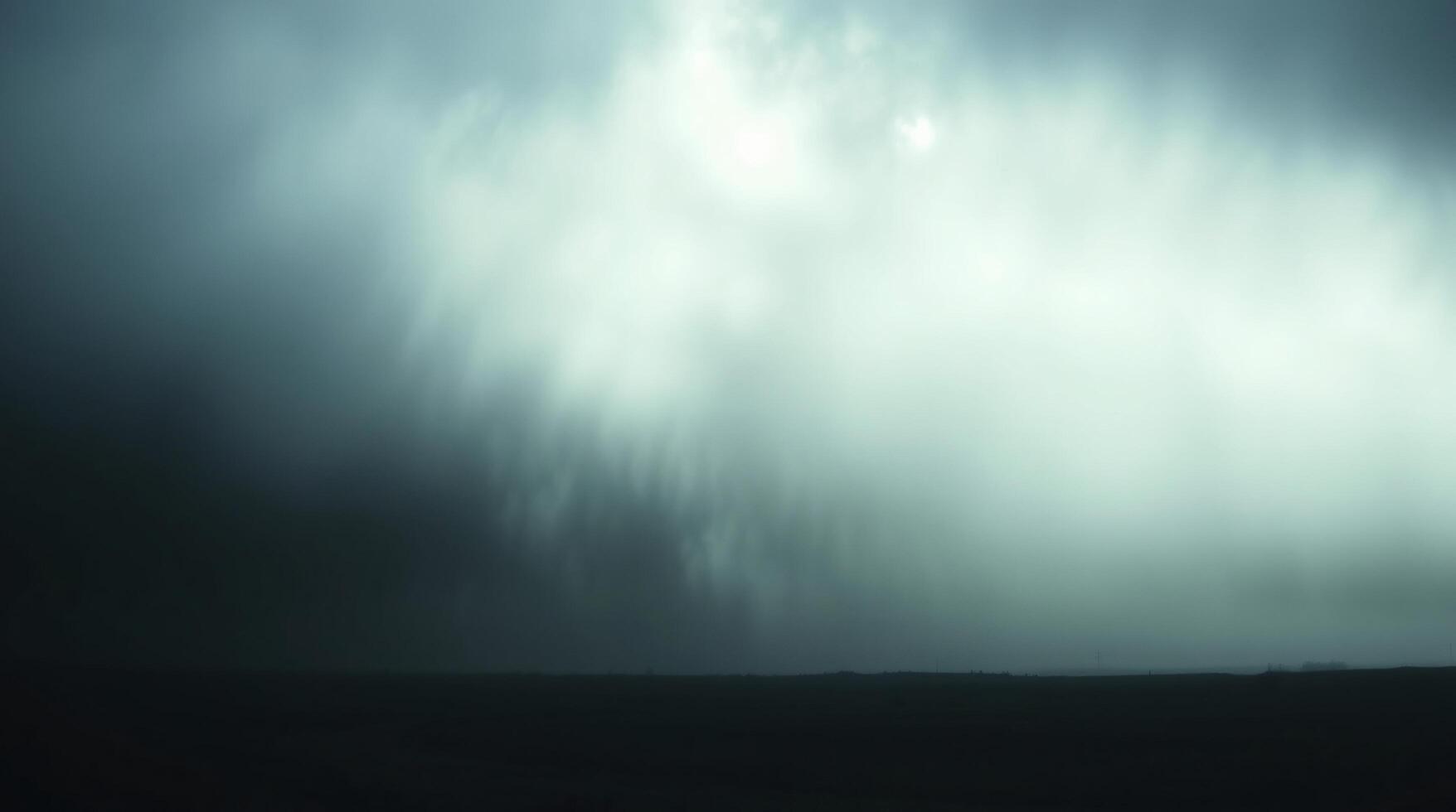 A dark and stormy sky with a lone person standing in the middle photo