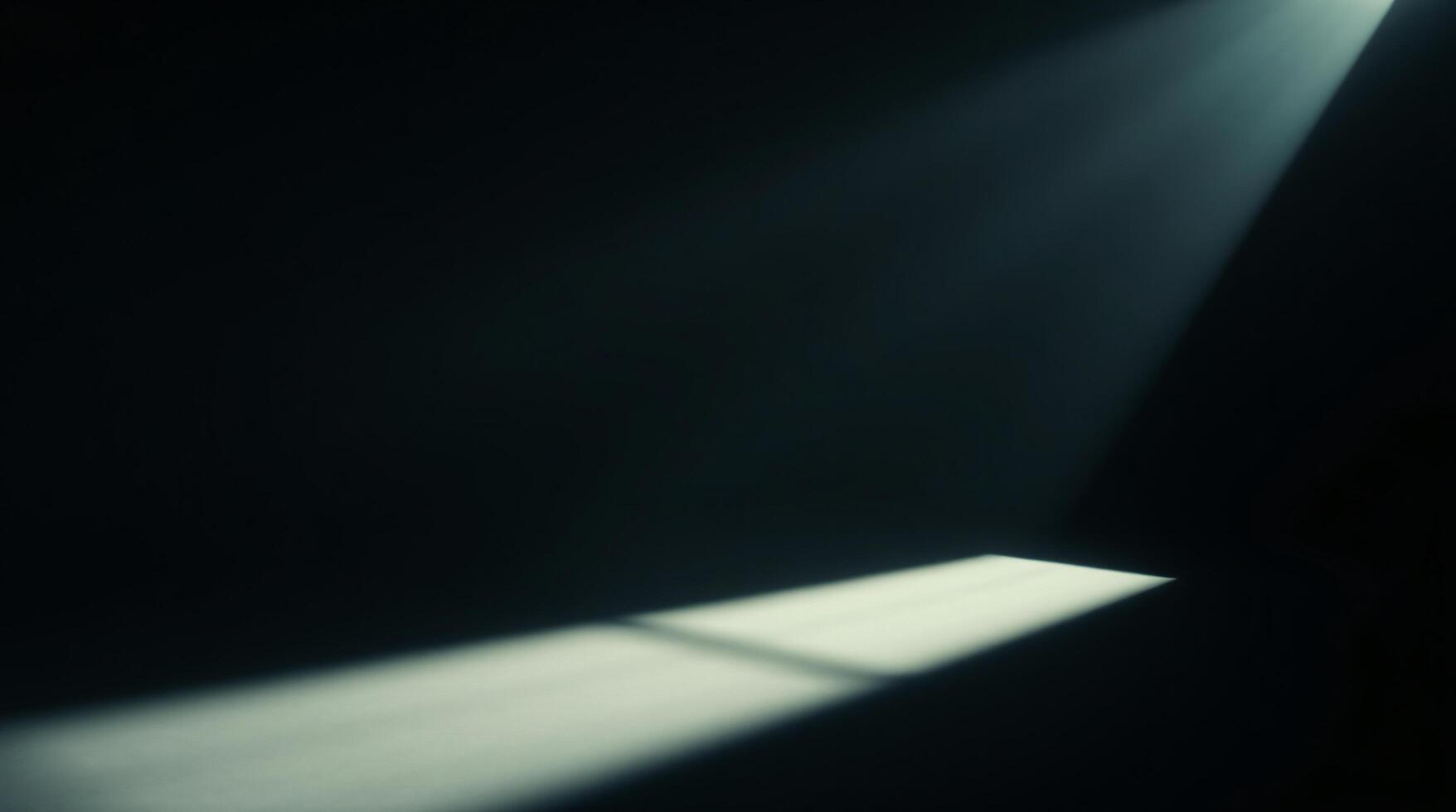 Light shining through a window in a dark room photo