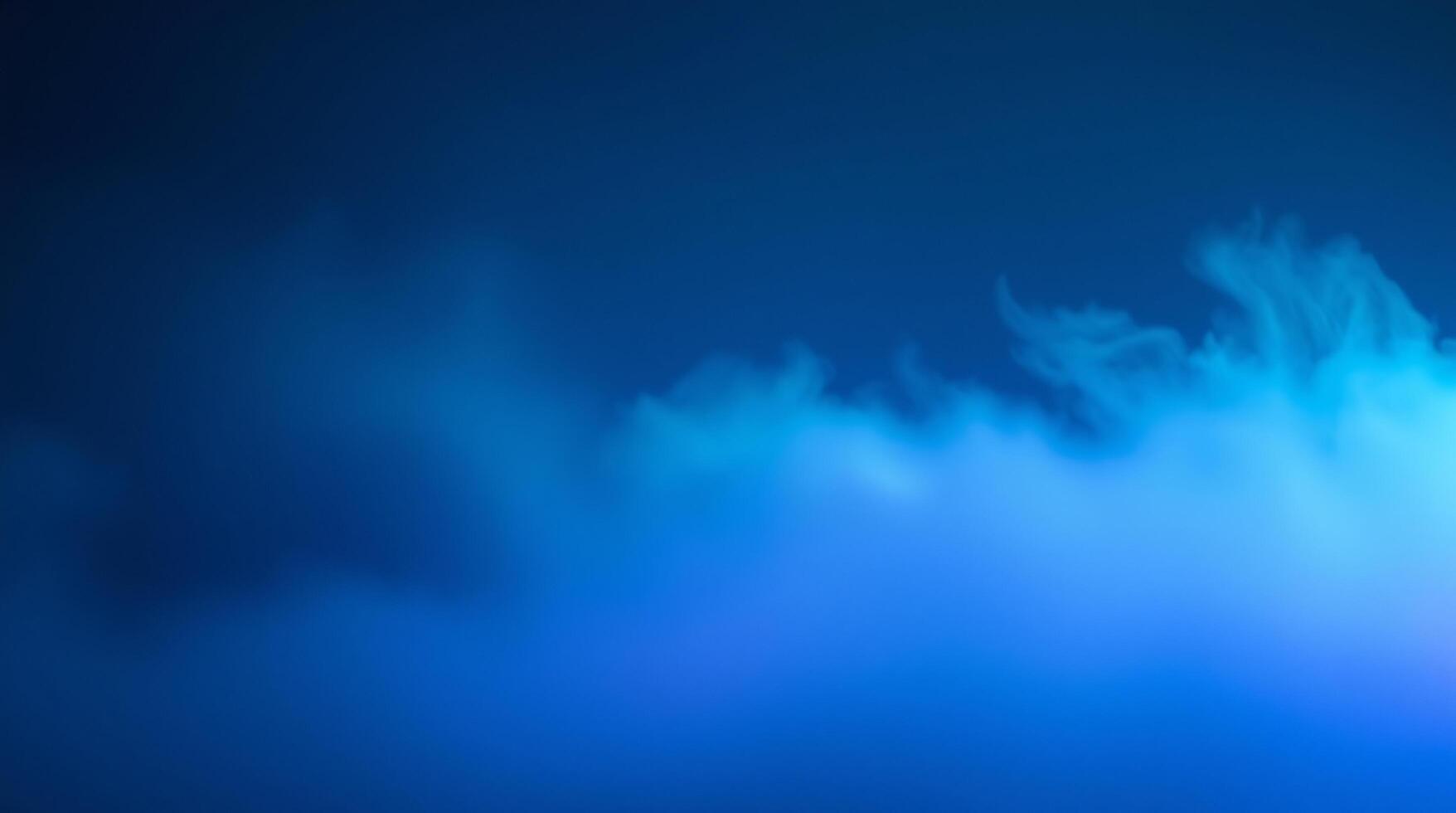 Blue smoke cloud on dark background photo