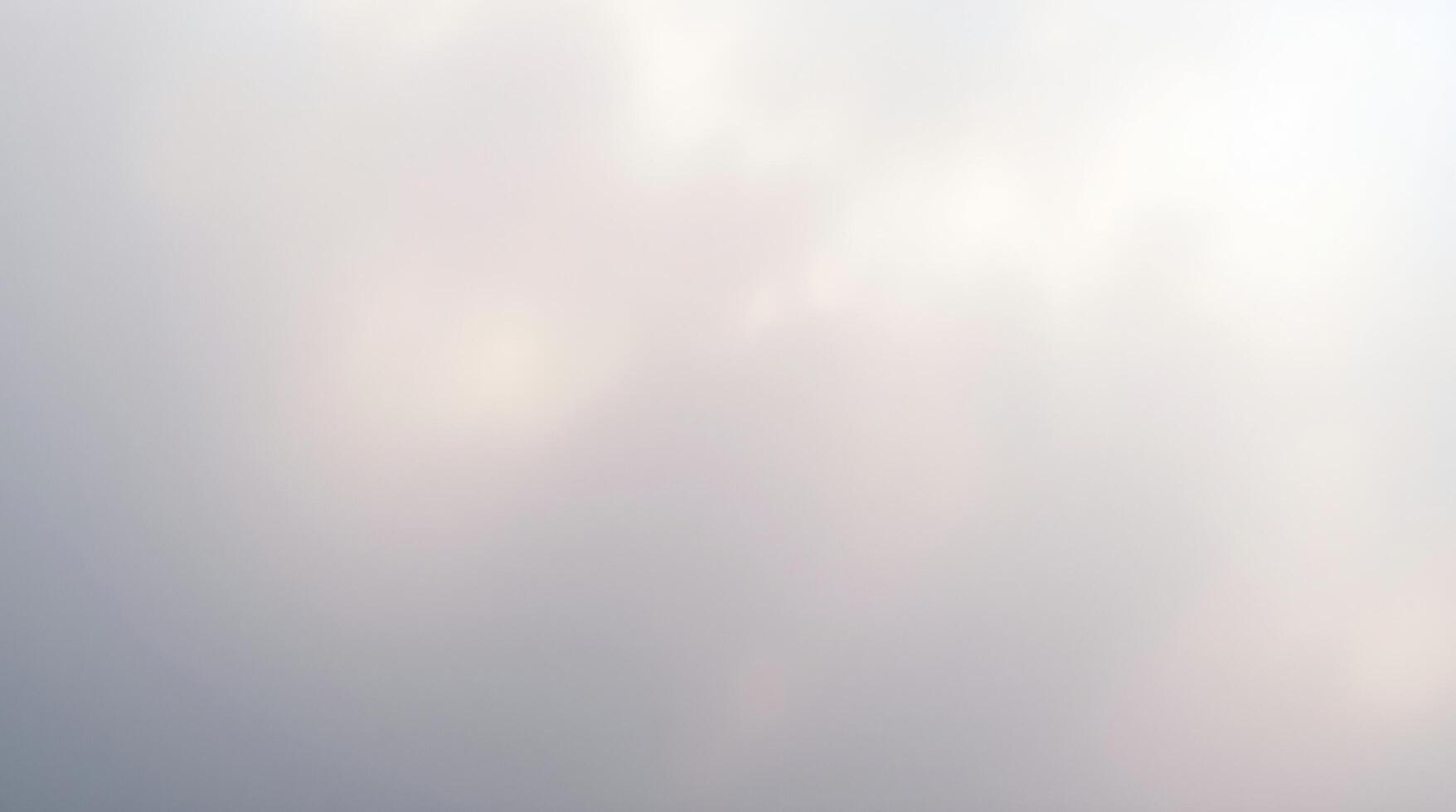 A plane flying through the sky with a cloudy background photo