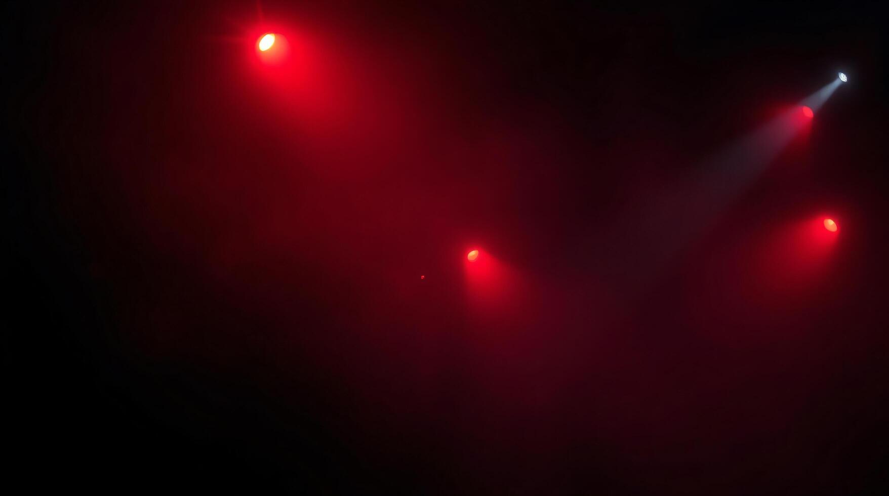 A red light is shining on a black background photo