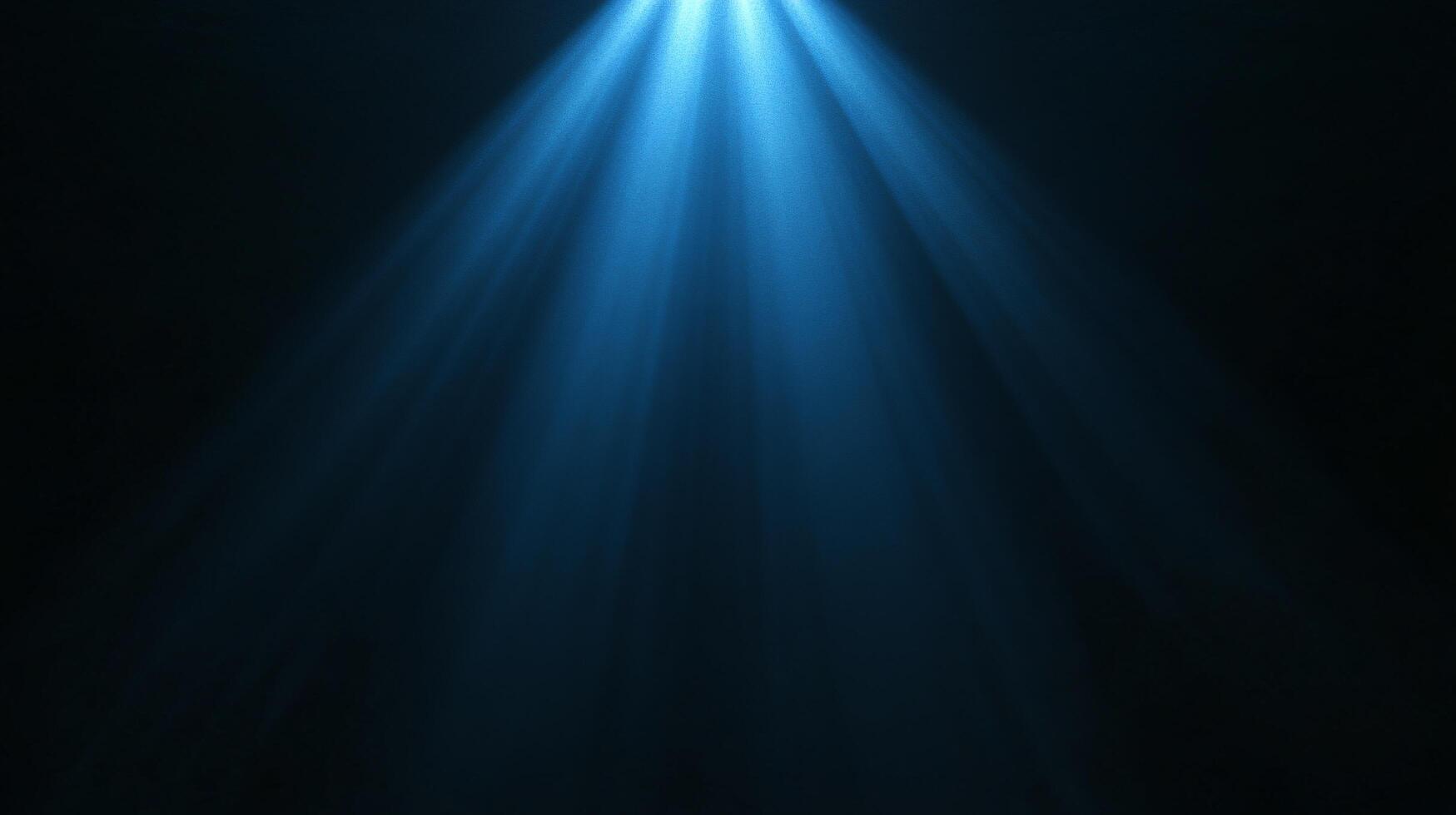 Soft illuminating blue spotlight in nebulous darkness photo