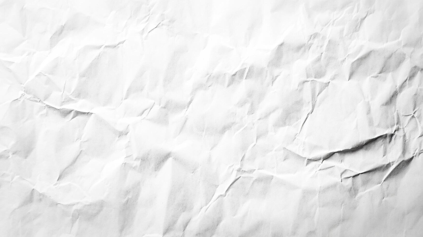 Crumpled white paper with subtle light and shadows photo
