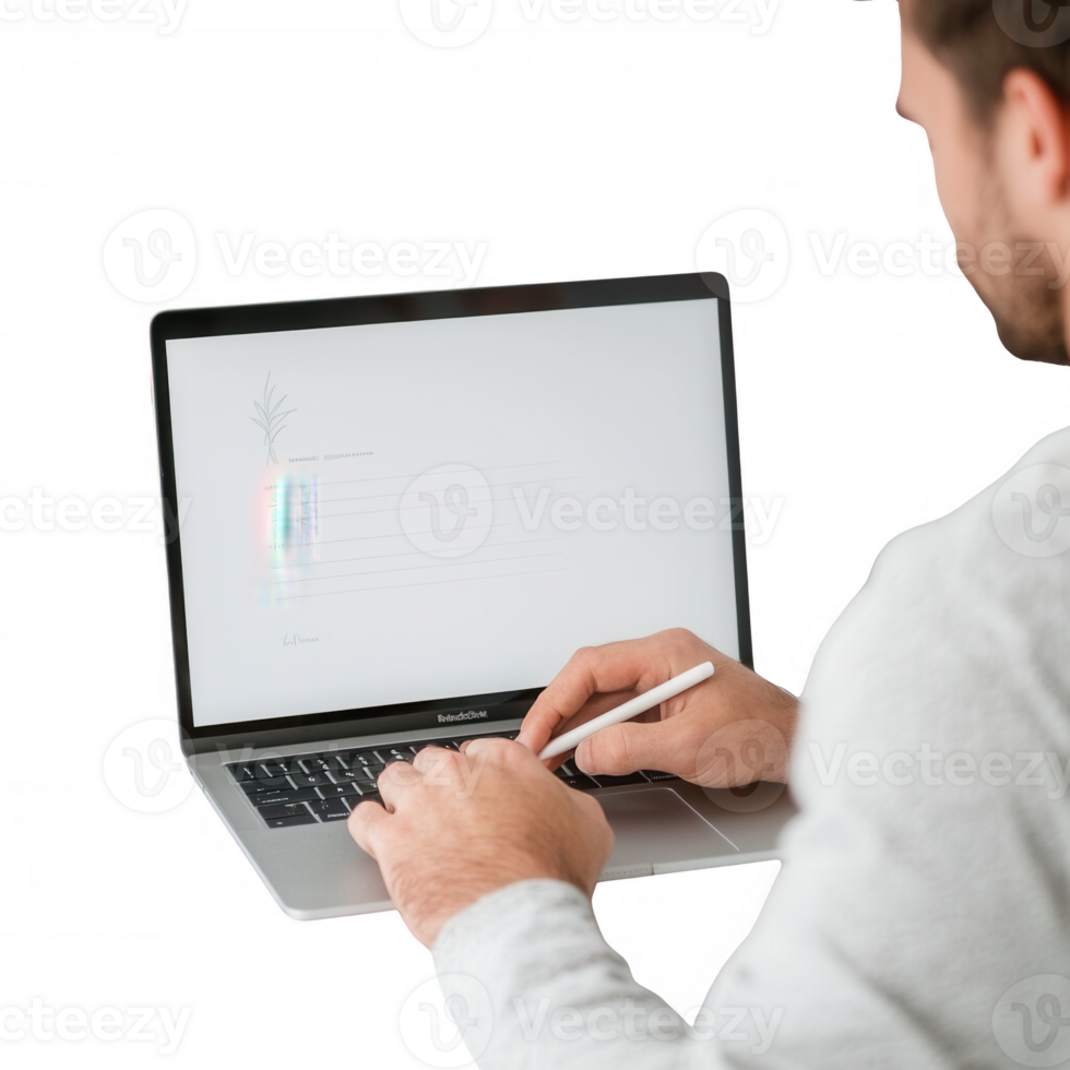 A man working on a laptop with a digital pen, focusing on creative tasks. png
