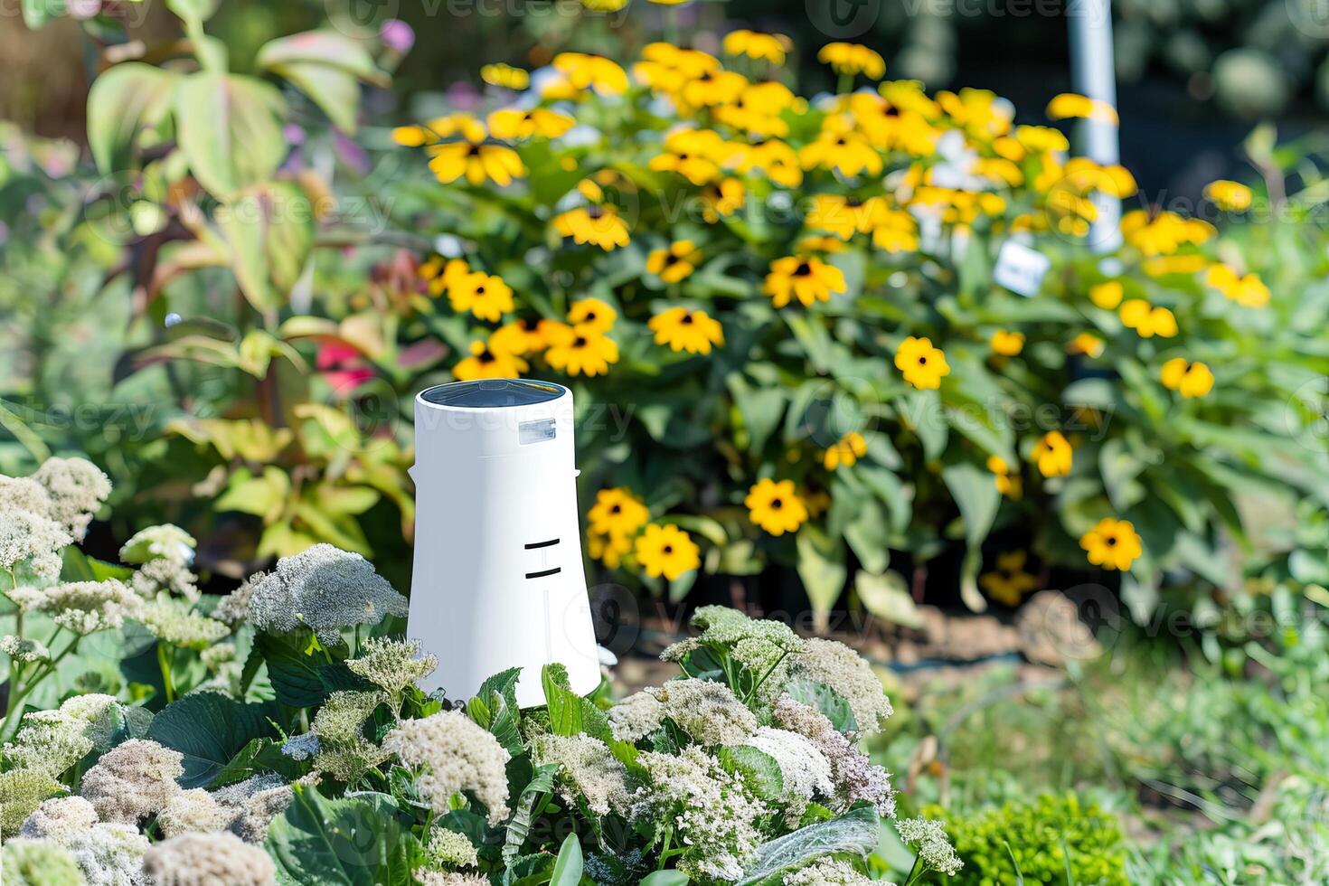 Smart garden device among vibrant flowers for eco-friendly gardening photo