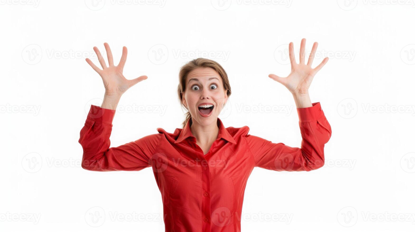 Excited woman in red blouse expressing joy with raised hands photo