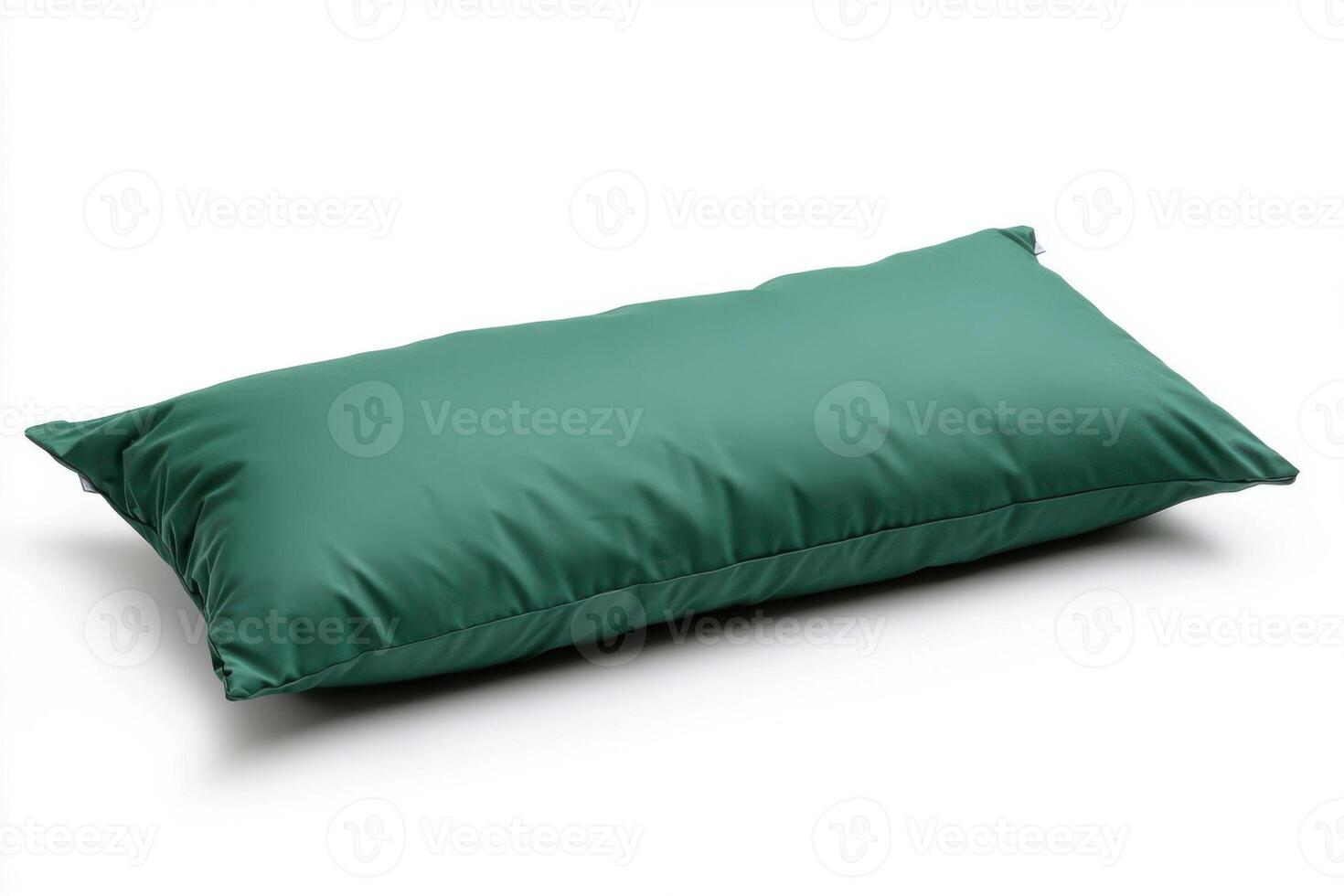 Comfortable green cushion placed on a clean white surface, ideal for home relaxation and decor purposes photo