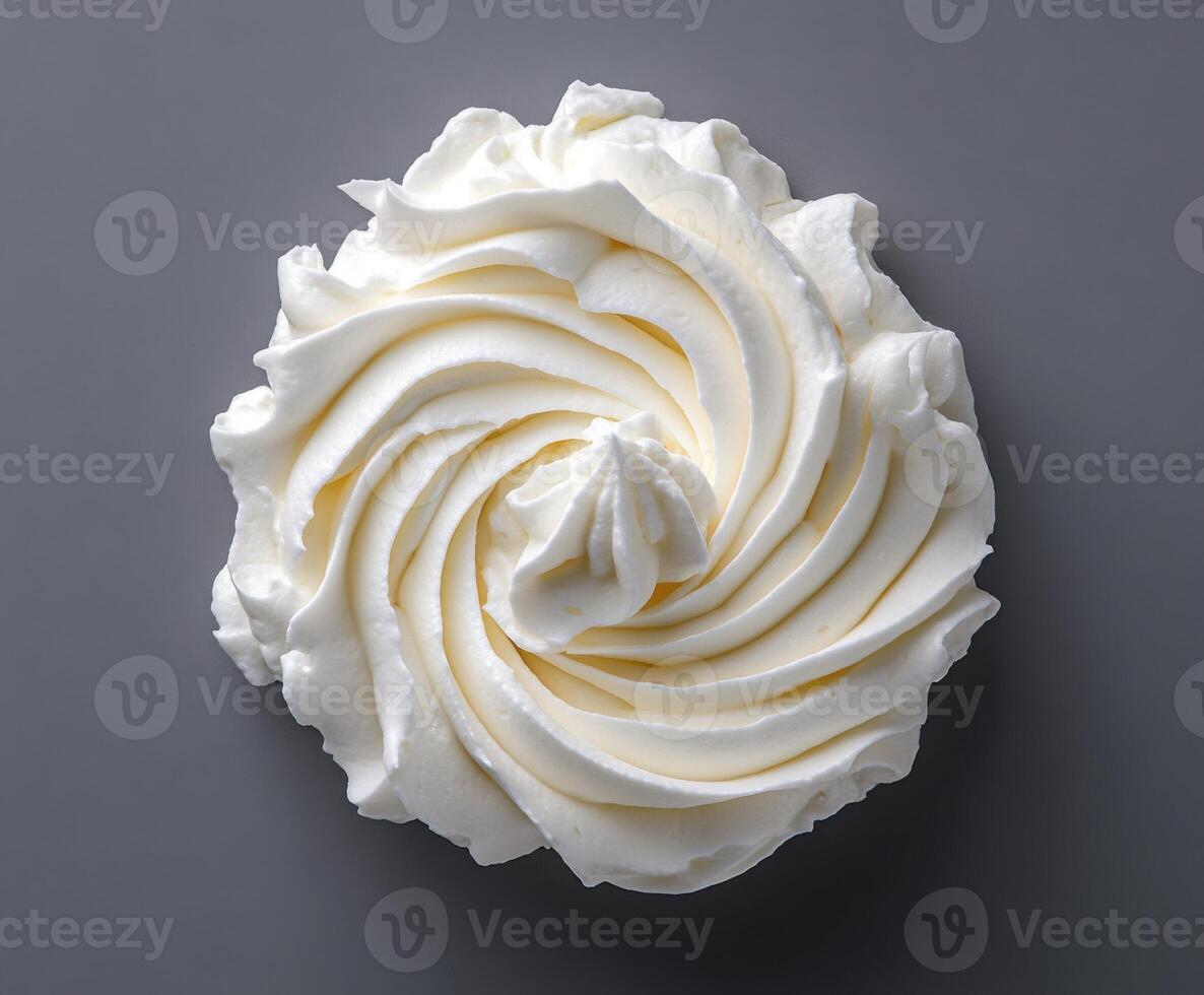Delicate swirl of whipped cream displayed on a neutral background for culinary delight photo
