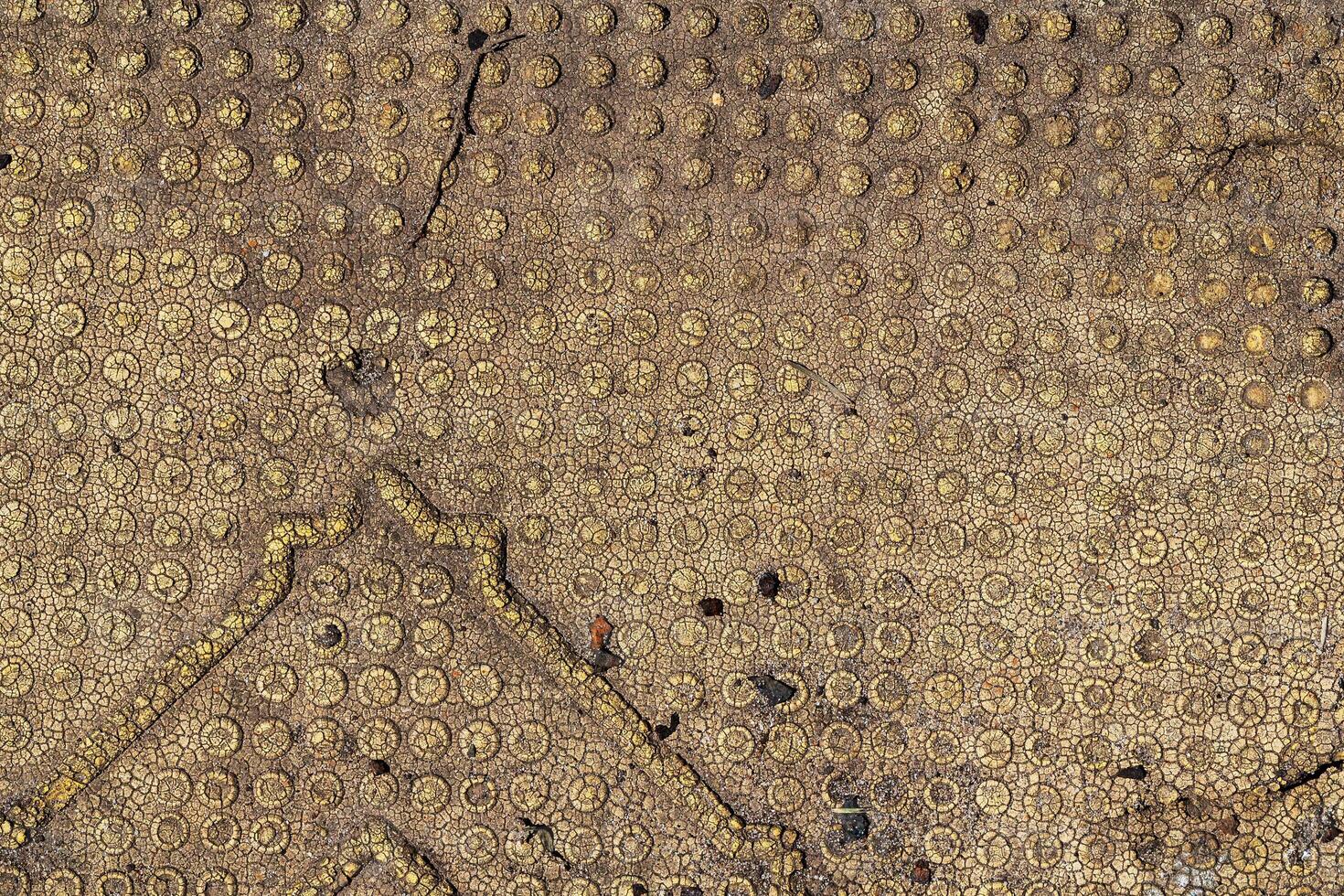 A close up of a gold patterned surface photo