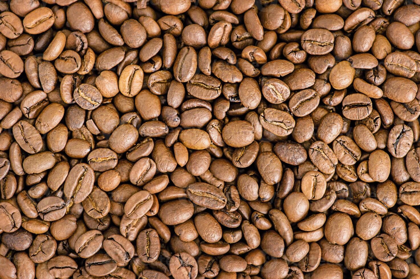 Coffee background. Roasted coffee beans. Perfect for concepts related to coffee production photo