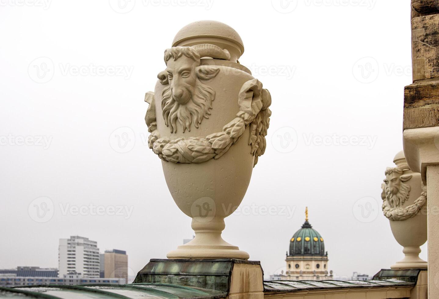 Rooftop view of the New German Cathedral golden adorned Dome in Berlin from the French Church terrace, showing contrast between historical and modern architecture, Foggy cloudy day. Copy space 1 photo