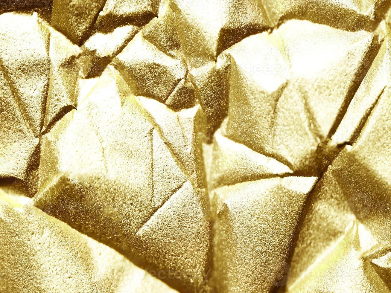 golden crumpled paper texture background photo