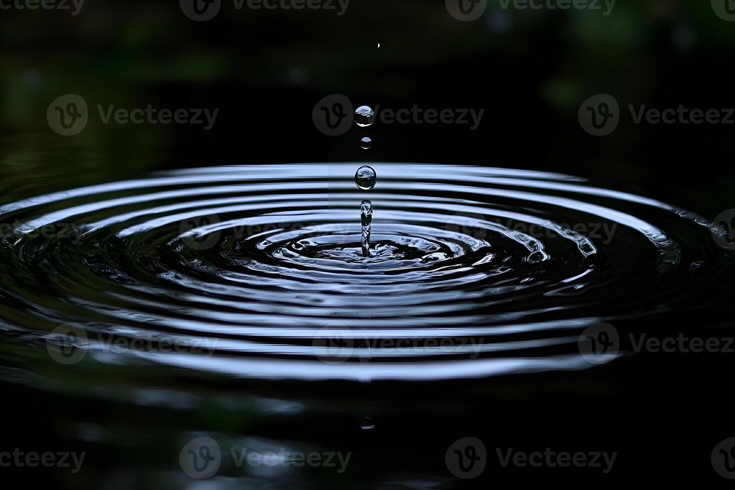 Aesthetic Water Droplet Ripples in Tranquil Setting for Nature Art and Design photo