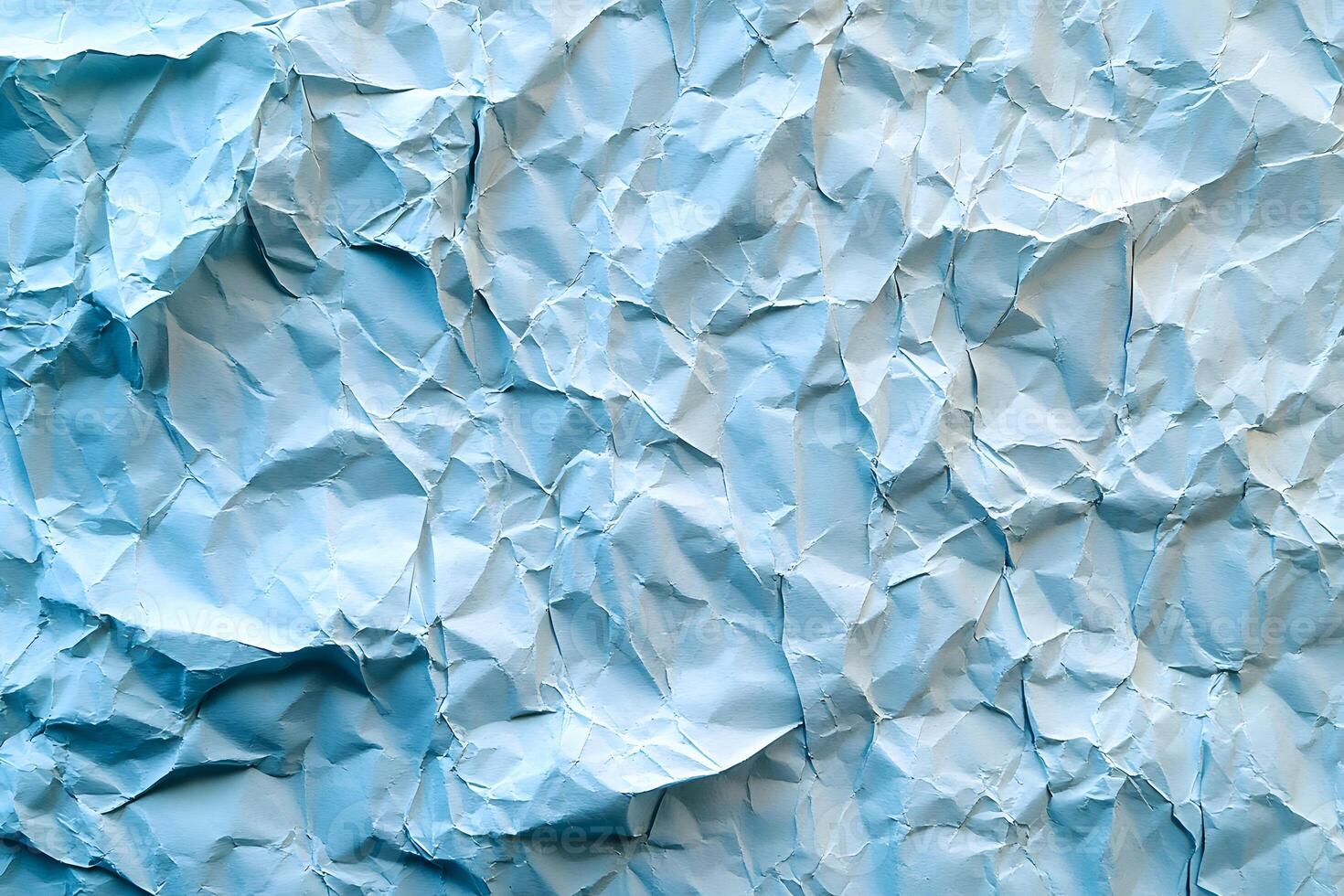 Textured Blue Wrinkled Paper Background for Design and Art Projects photo
