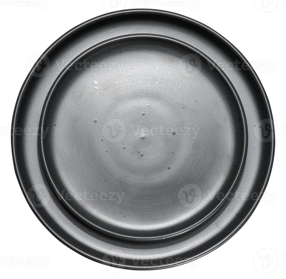 Empty black ceramic plate on isolated background, top view photo