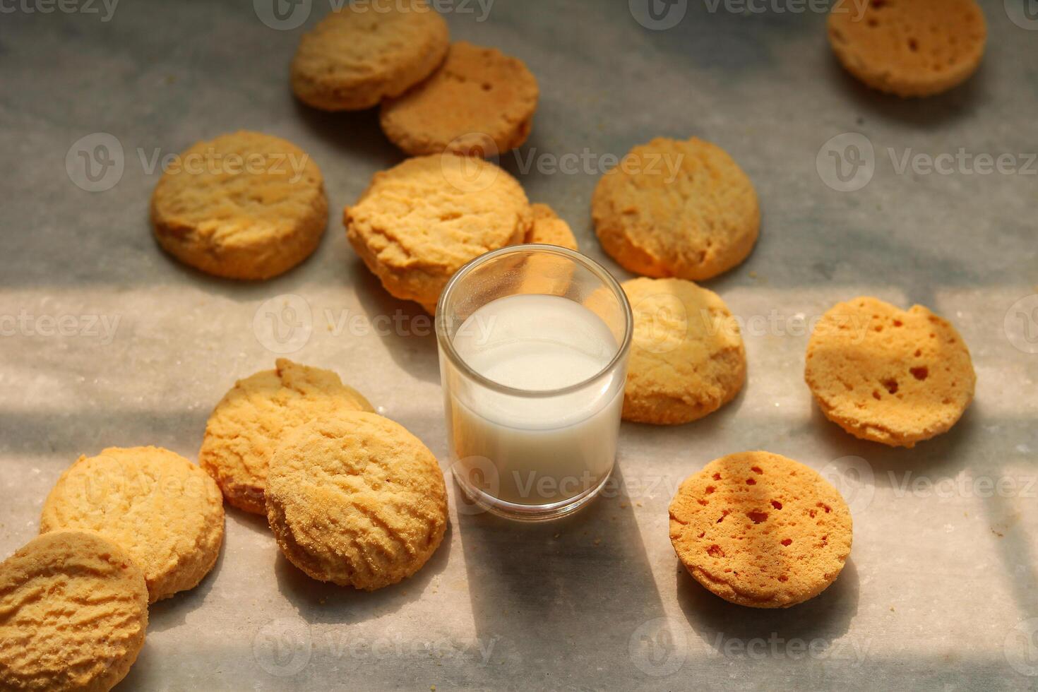 Milk in glass and cookies on the table photo