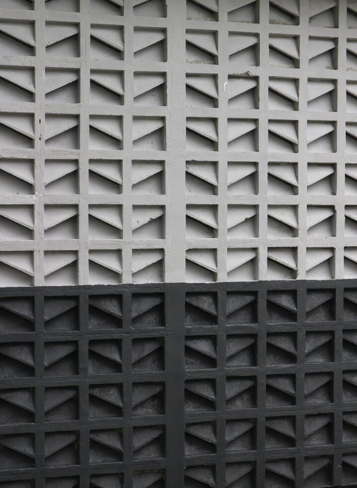 a black and white wall with squares on it photo