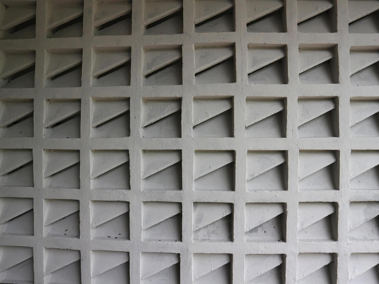 a wall with a pattern of squares on it photo