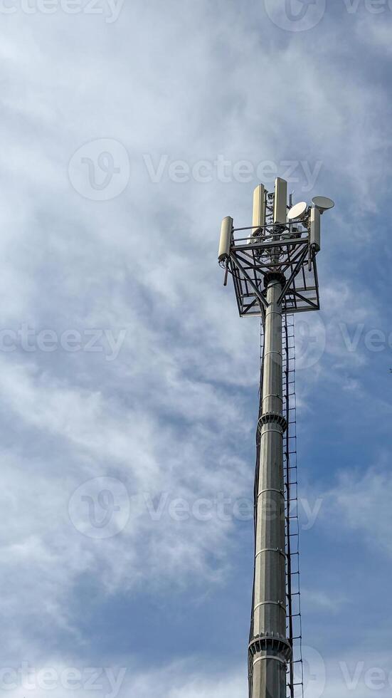 Mobile data tower with antennas against a blue sky. The concept of telecommunication equipment, high-speed mobile communication. High quality photos