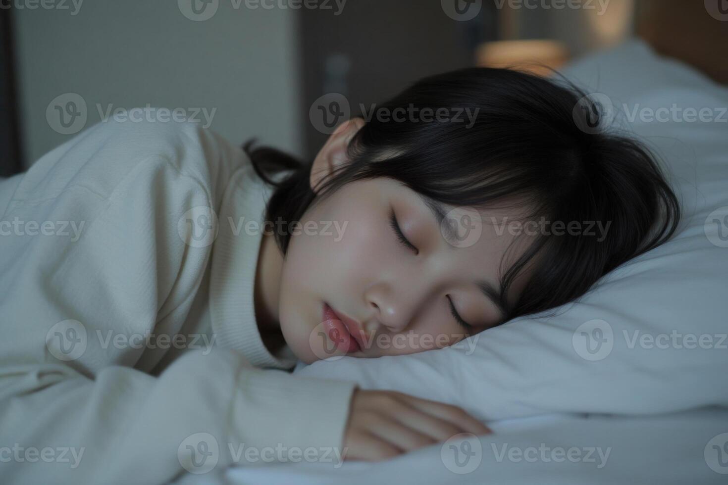 Close-up of asian teenage girl sleeping in her bed photo