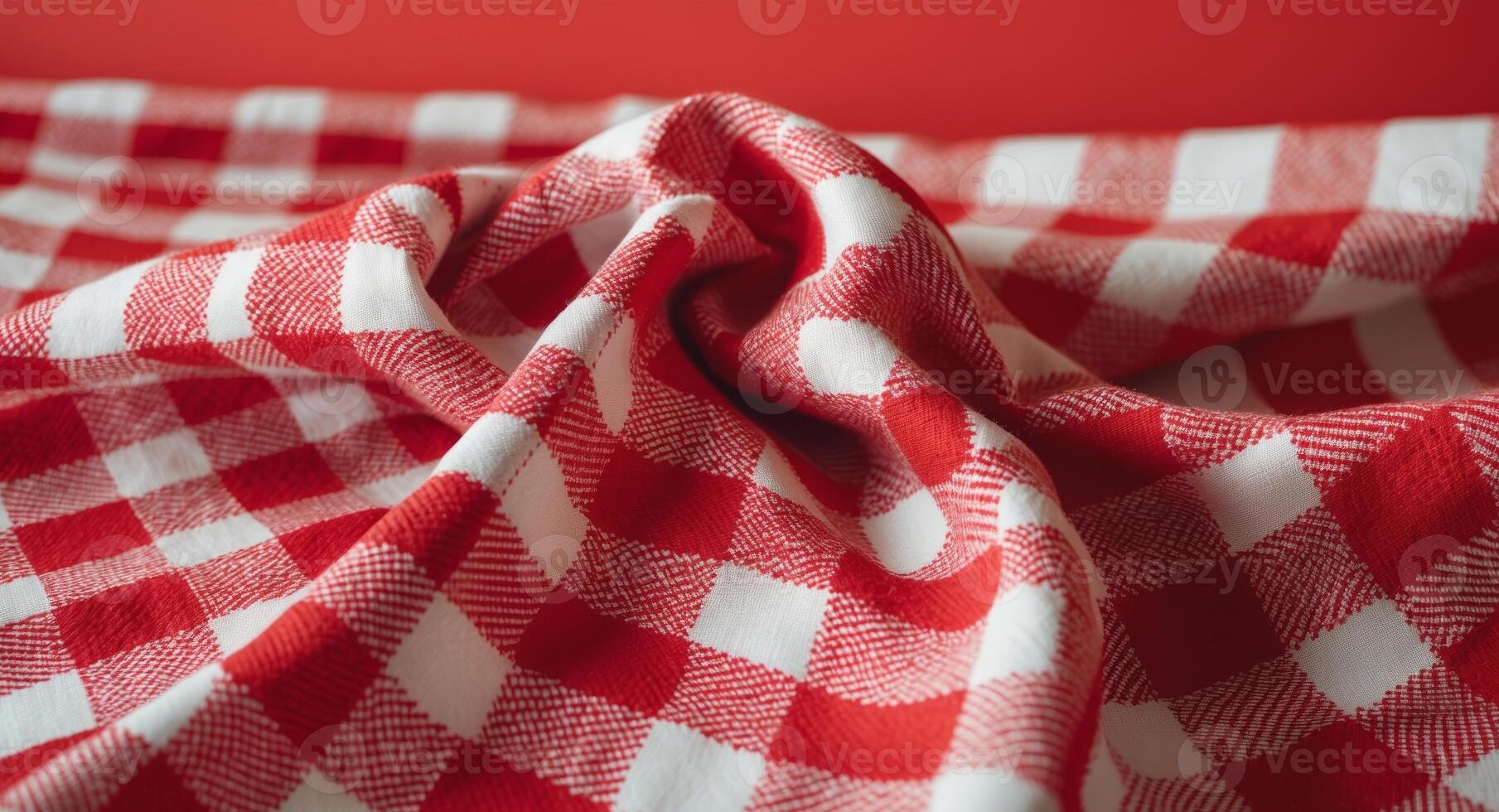 Red and white checkered tablecloth textile texture on a vibrant red background for backgrounds and design projects. photo