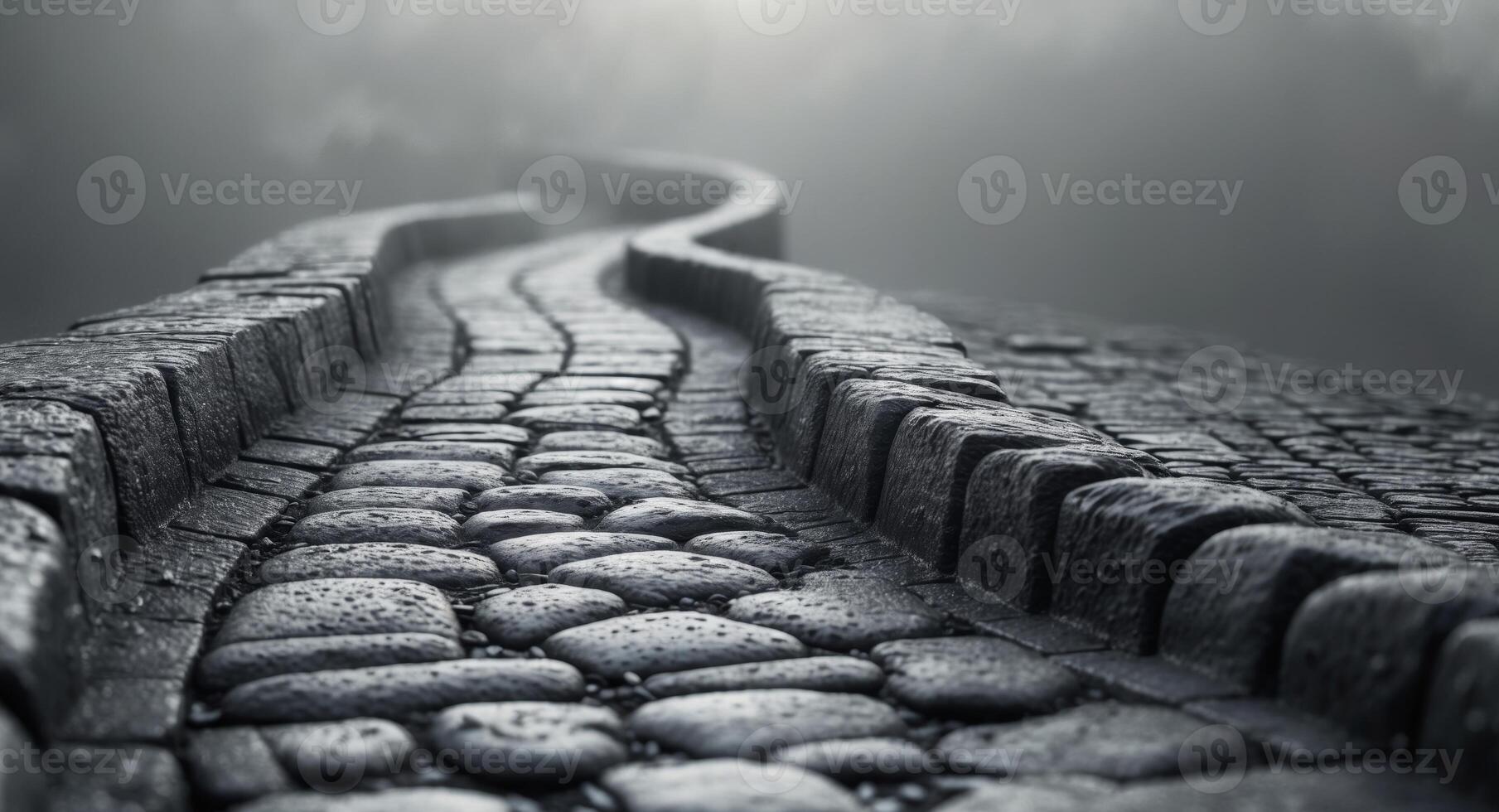 Dark gray cobblestone pathway with textured surfaceDark gray cobblestone pathway with textured surface. photo