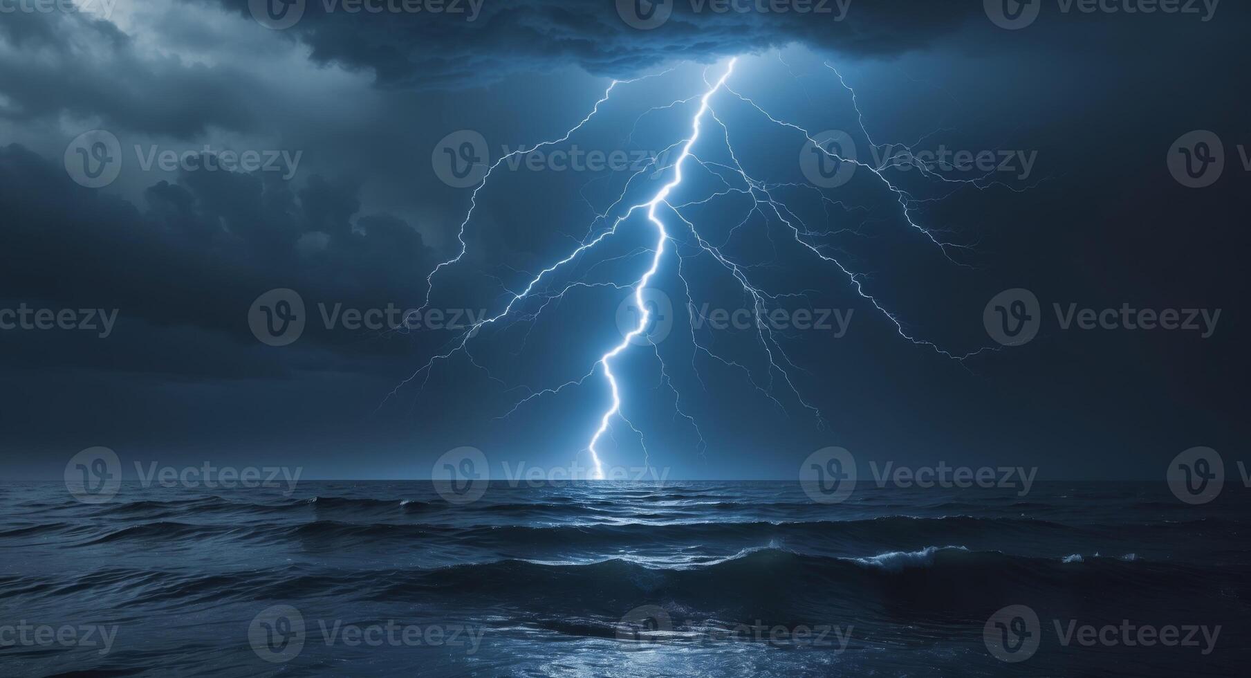 A Majestic Lightning Bolt Illuminates the Dark Ocean Below Creating an Awe Inspiring Contrast of Nature's Power and the Tranquility of Water photo
