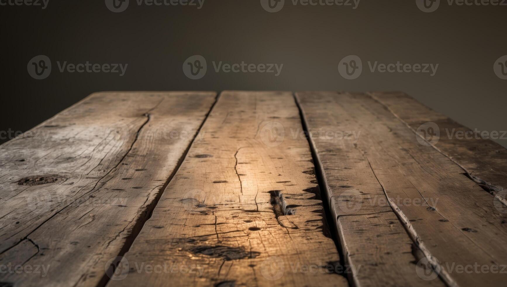 A rustic wooden table with a weathered surface illuminated by soft lighting creating a warm and vintage atmosphere in a dark setting photo