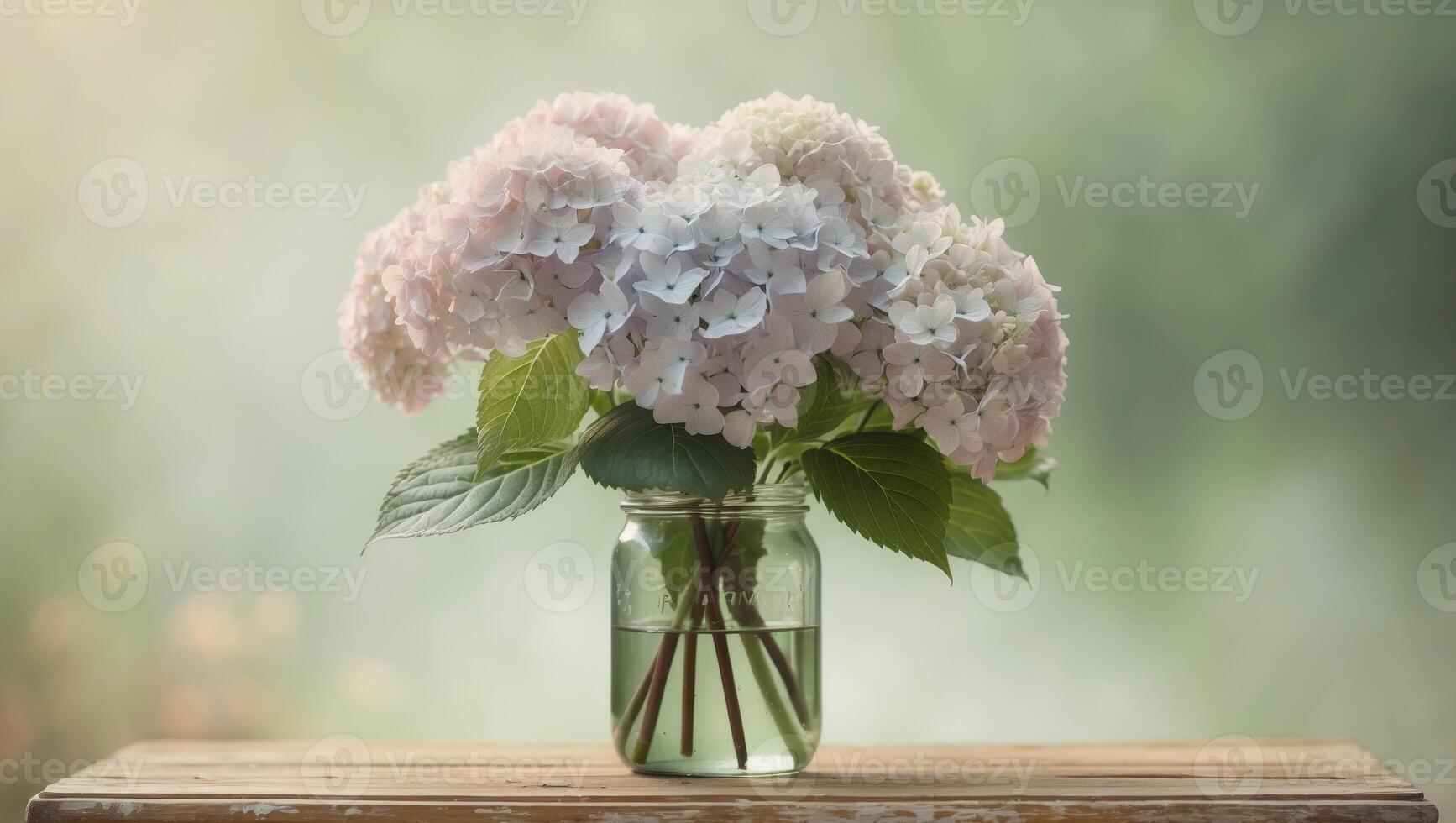 Bouquet of hydrangeas flowers in a glass jar on a wooden table with blurred green background. photo