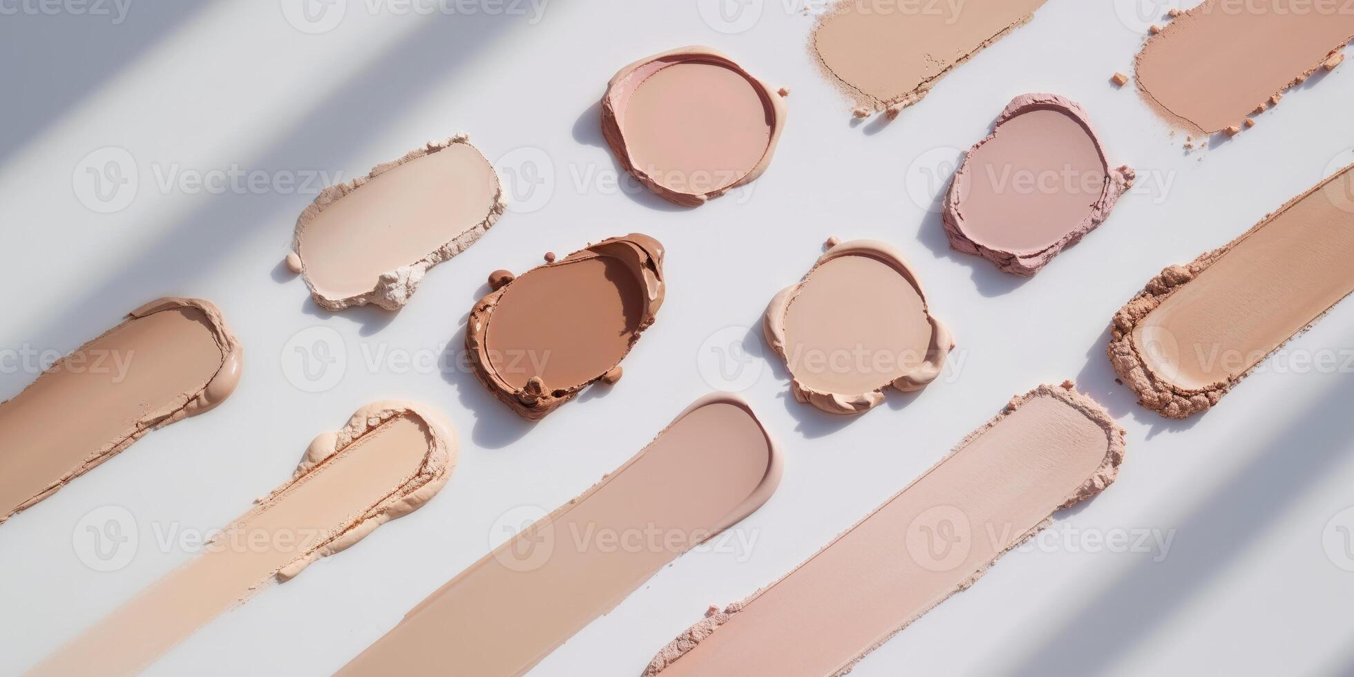 Creative Layout of Various Foundation Shades in Smudges and Swatches photo