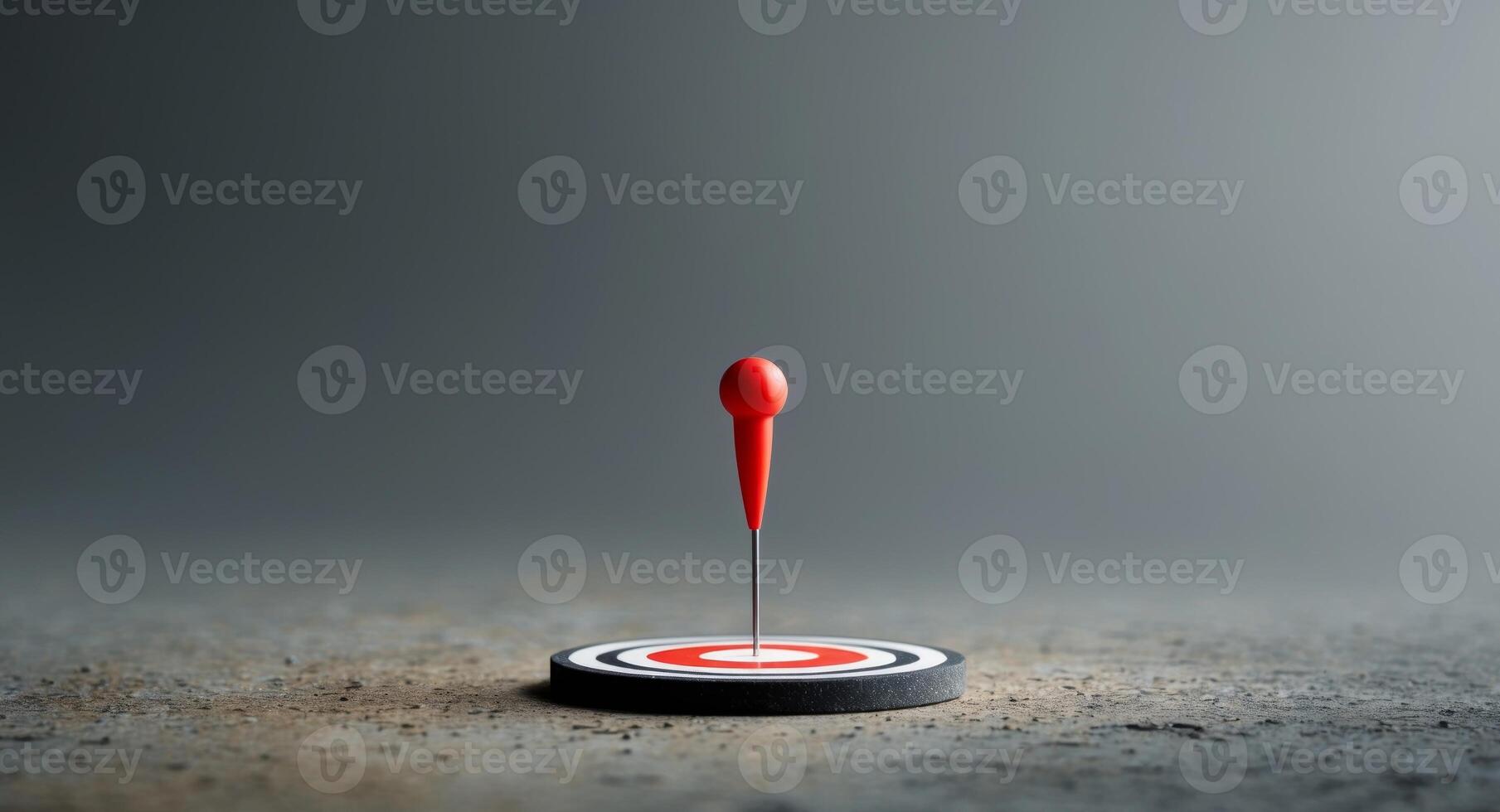 Red pin in the center of circular target on textured surface photo