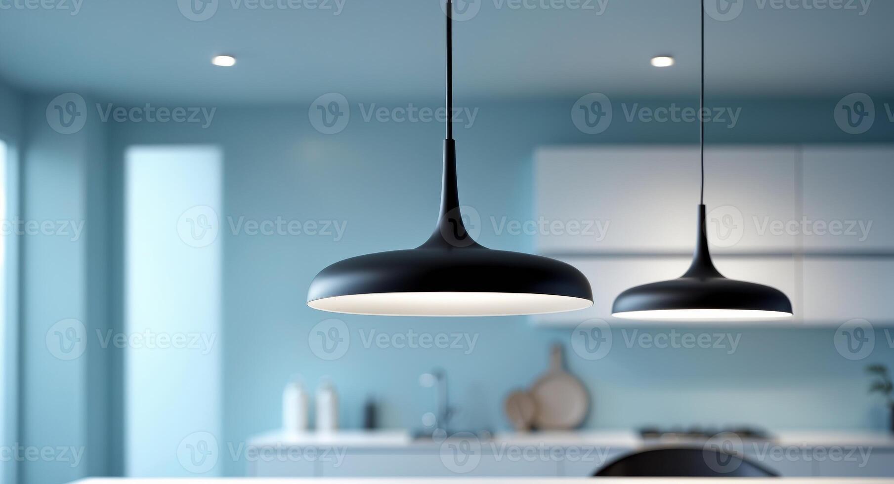 Modern Black Pendant Light Fixture in Contemporary Kitchen with Soft Blue Background. photo