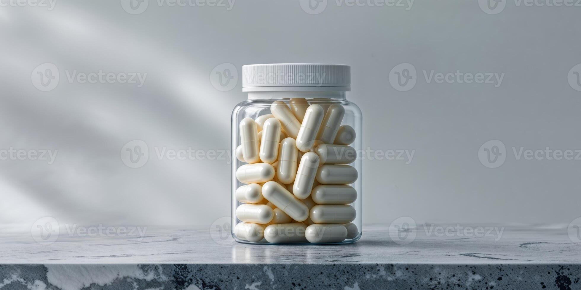 Jar of Capsules on Granite Surface with Soft Focus. photo