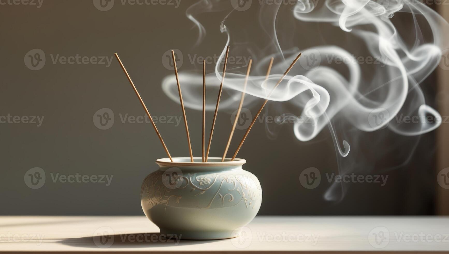 Bamboo incense sticks releasing fragrant smoke from a decorative pot in a quiet indoor setting photo