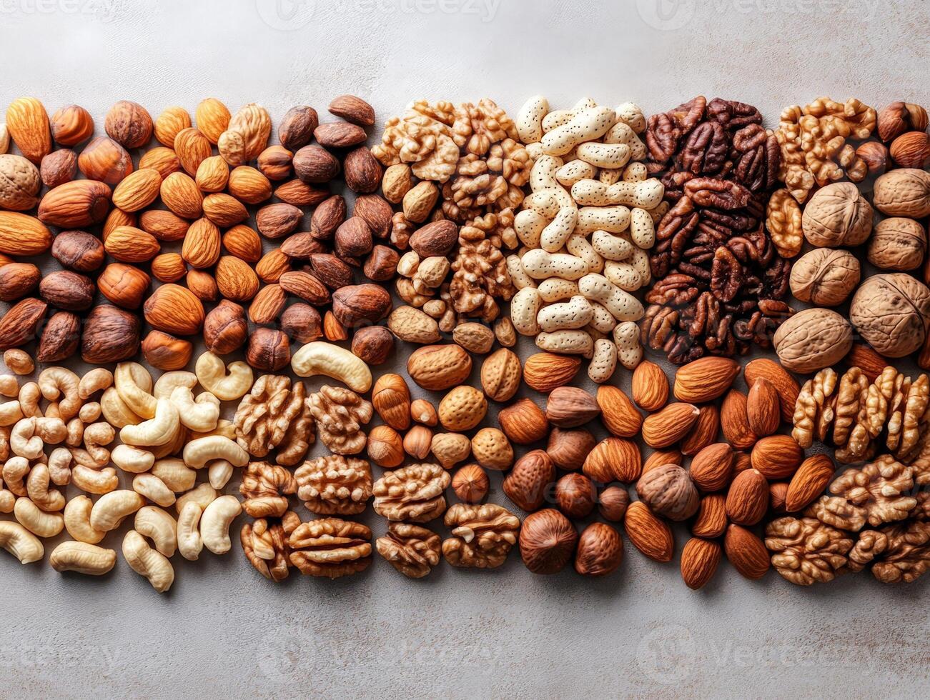 A vibrant assortment of various nuts and seeds arranged in a visually appealing pattern. photo