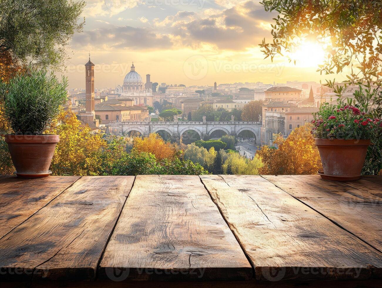 A scenic view of Rome at sunset with potted plants and a wooden table in the foreground. photo