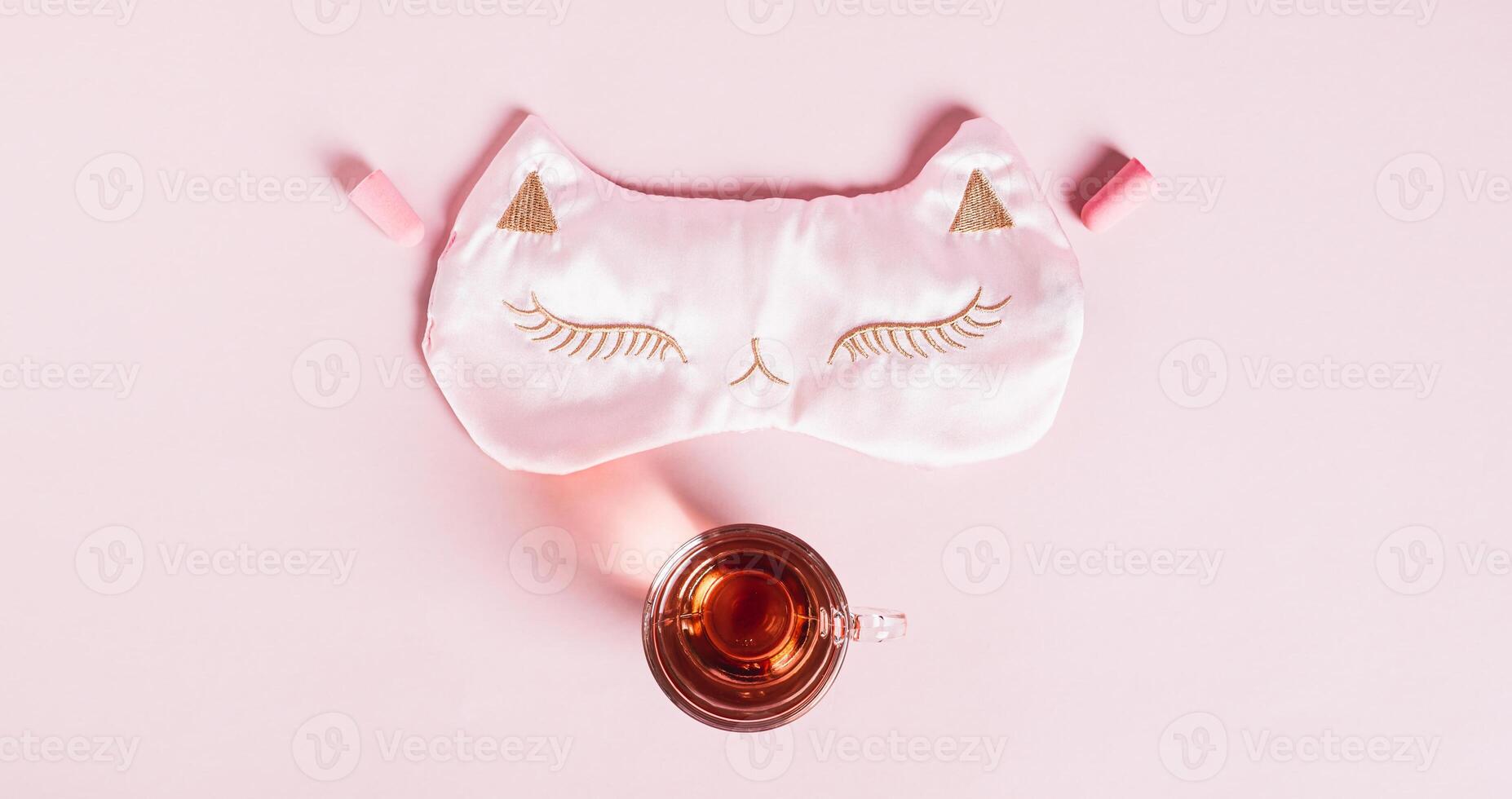 Concept insomnia sleep mask, earplugs and cherry juice with magnesium on pink web banner photo