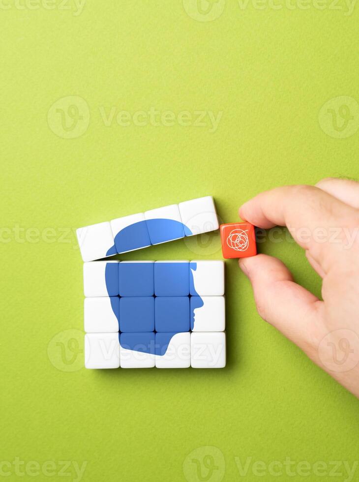 The hand tries to put a bad thought into the mind or confuse the opponent. Propaganda. Information garbage. To deceive. Psychological tactics in competition, impact of confusion and mental games photo