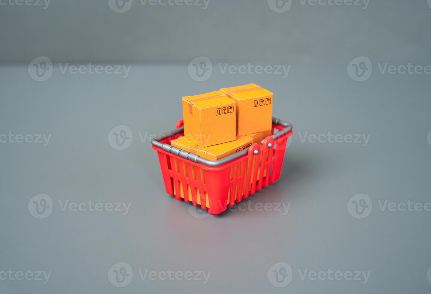 A basket with boxes of goods. Buyer behavior, consumer patterns and preferences. Logistics and supply of retail outlets. photo