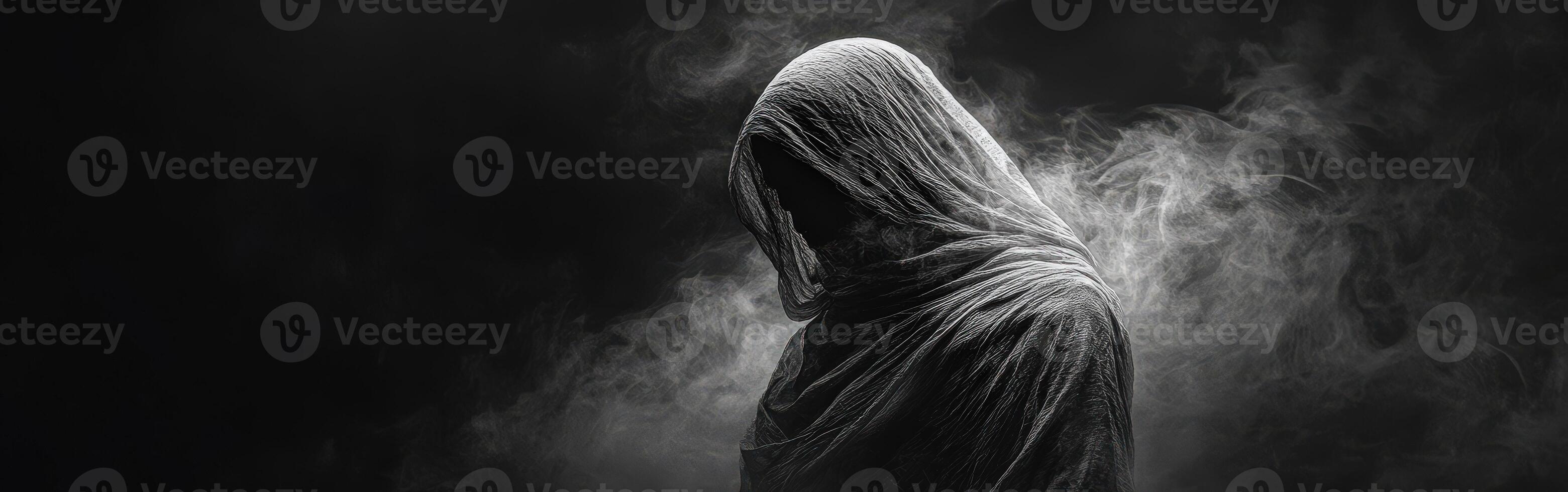 Mysterious figure in dark attire surrounded by swirling fog during nighttime photo