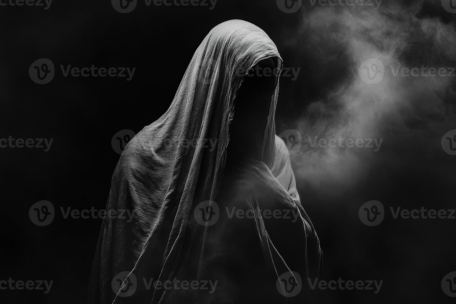 Mysterious figure shrouded in smoke and darkness creating an eerie atmosphere photo