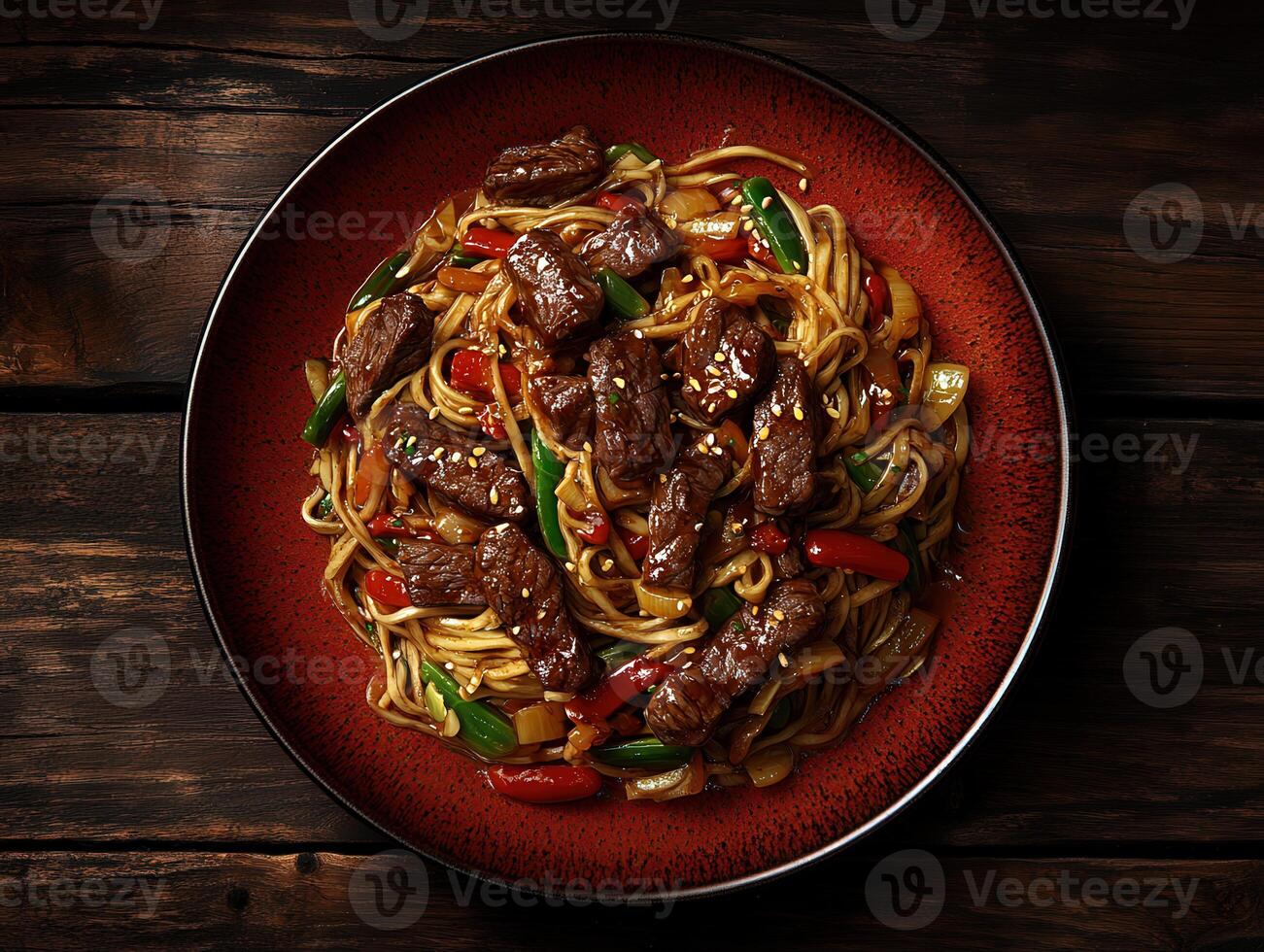 Delicious stir-fried noodles with beef and vegetables served in a rustic setting photo