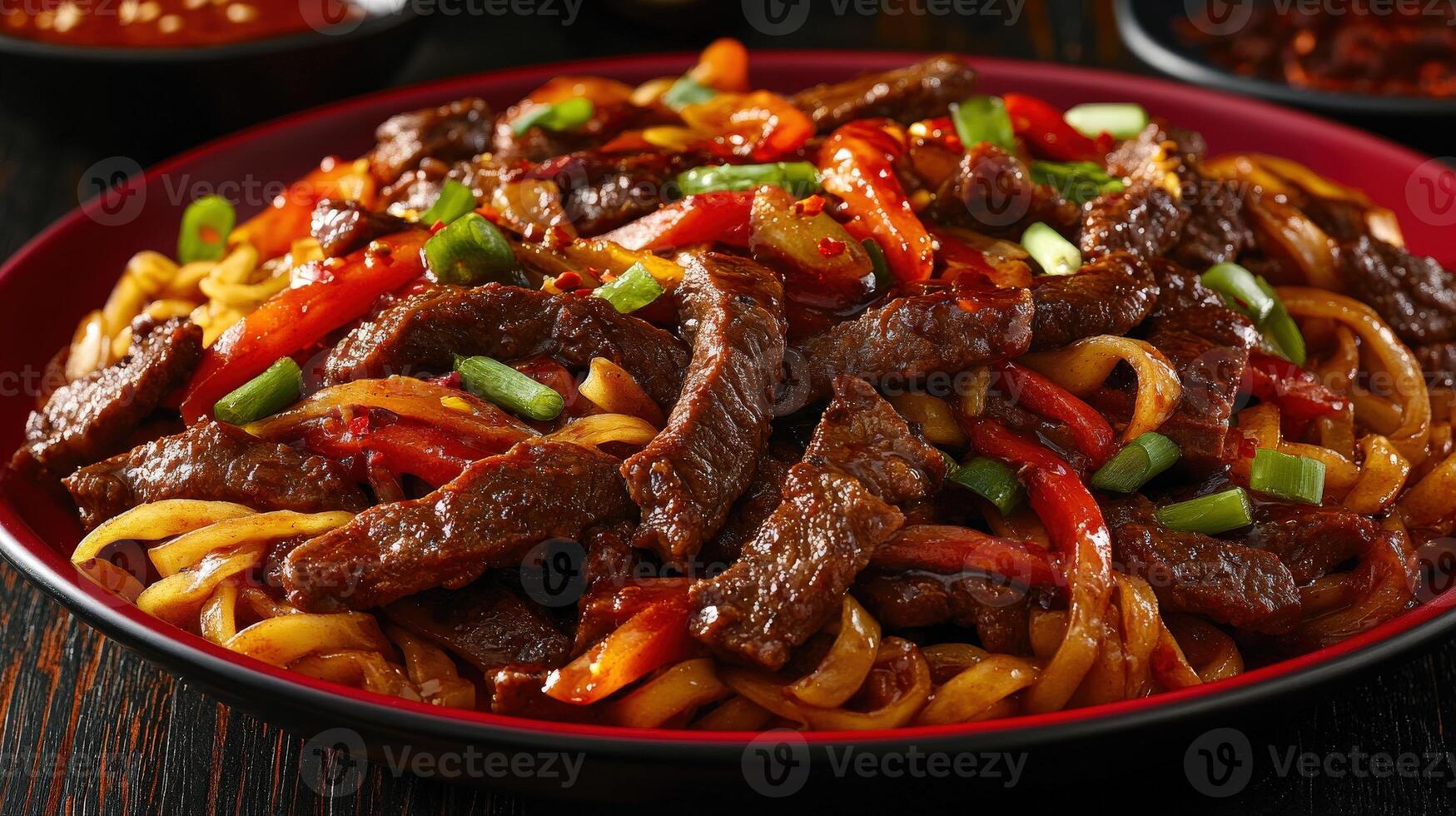 Delicious stir-fried beef noodles with vegetables served in a bowl photo