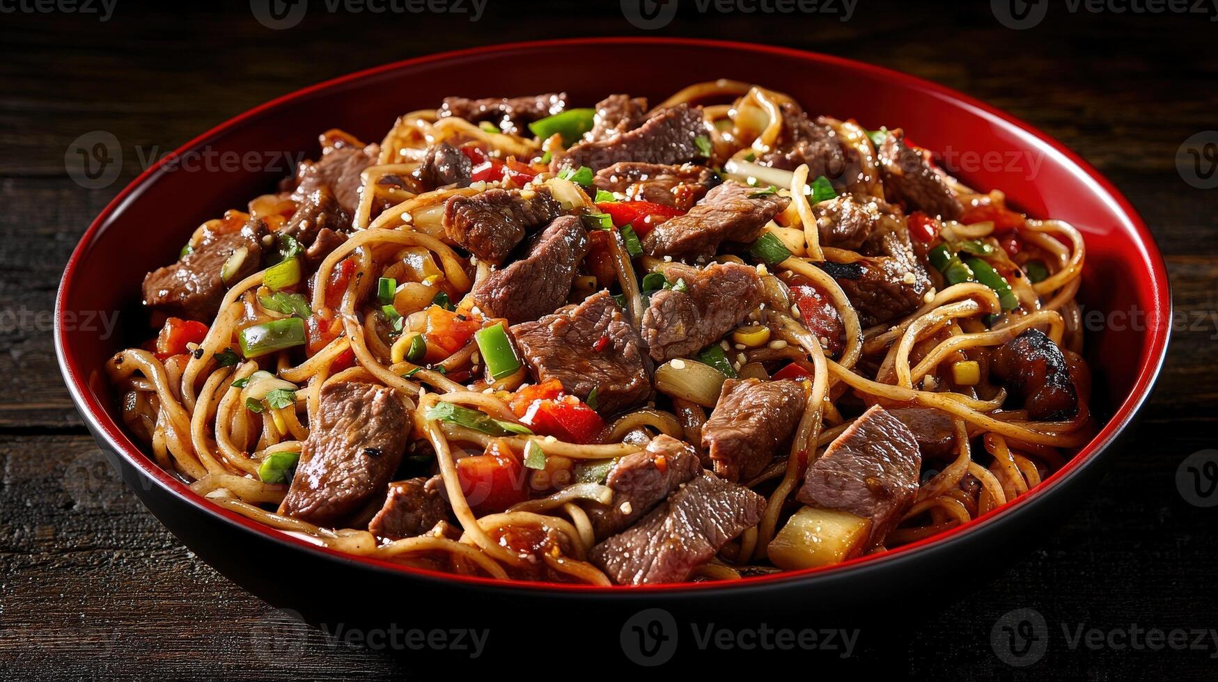 Sizzling beef stir-fry with noodles and vegetables in a bowl photo