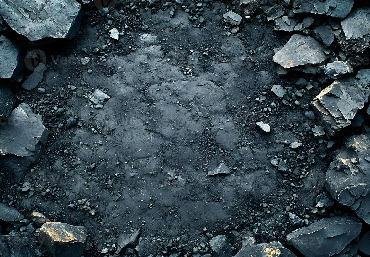 Dark Grey Rocks Surround Dark Soil Background photo