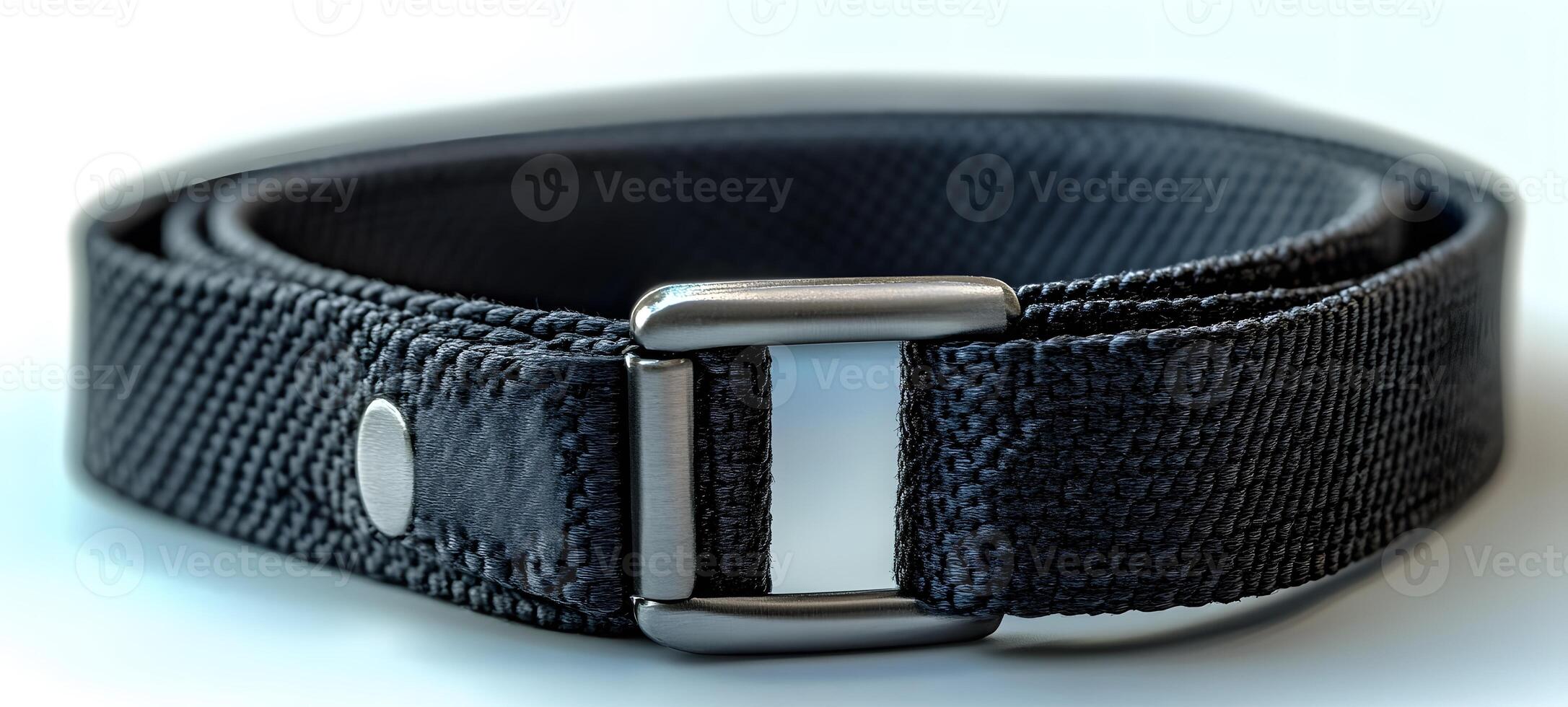 Black woven belt with a metallic buckle photo